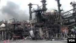 The remains of a Cameroon refinery in Limbe are seen after an explosion shook the facility over the weekend, June 2, 2019 (M. Kindzeka for VOA)