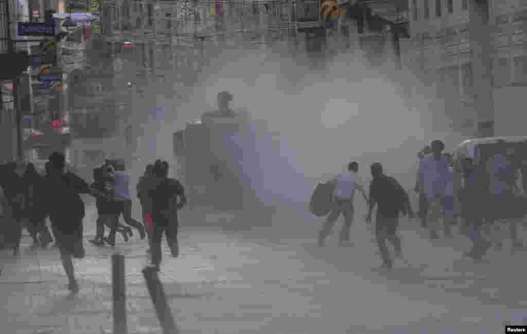 Riot police use a water cannon to disperse protesters in central Istanbul, July 8, 2013.