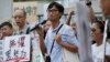 Land reform campaigner Eddie Chu, center, speaks as he thanks his supporters for their vote in the legislative elections in Hong Kong, Sept. 10, 2016.