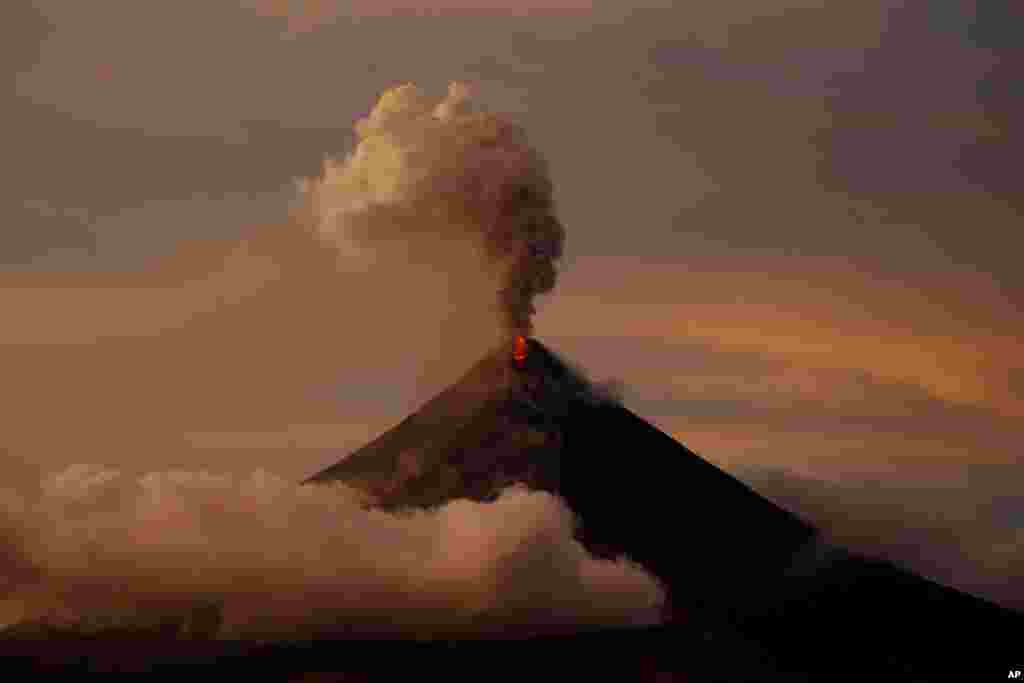 The Mayon volcano erupts anew at sunset in Albay province, Jan. 26, 2018.
