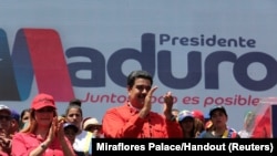 El presidente Nicolás Maduroy su esposa Cilia Flores durante un acto de campaña en Ciudad Guayana, Venezuela, el 23 de abril, de 2018.