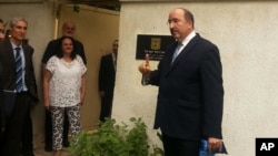 This Sept. 9, 2015 image released on the official Facebook page of the Israeli Embassy in Egypt shows Dore Gold, Israel's Foreign Ministry director-general at the re-opening of the embassy in Cairo, Egypt, four years after an Egyptian mob ransacked the site where the mission was previously located.