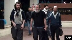 Screengrab from a video released by Dogan News Agency shows (from L) Edouard Elias, Didier Francois, Pierre Torres and Nicolas Henin arriving at the Mehmet Akif Inan Training & Research Hospital at Sanliurfa, near the Syrian border, Apr. 19, 2014.