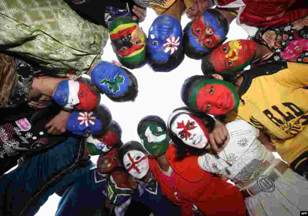 School children with their faces painted in the colours of the national flags of the countries participating in the upcoming Cricket World Cup in the northern Indian city of Lucknow (Reuters/Pawan Kumar)