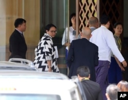 Indonesian Foreign Minister Retno Marsudi, second left, arrives at Foreign Ministry to meet with Myanmar's Foreign Minster Aung San Suu Kyi in Naypyitaw, Myanmar, Sept. 4, 2017.