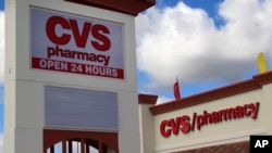 FILE- A CVS pharmacy in Hialeah Gardens, Florida. The company says it will stop selling all tobacco products by October 1. 