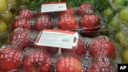 FILE - Apples imported from the United States are displayed for sale at a Sam's Club in Mexico City, May 31, 2018. 