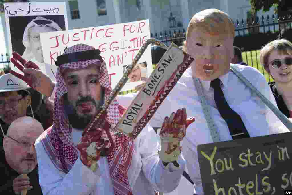 Demonstrators dressed as Saudi Arabian Crown Prince Mohammed bin Salman and US President Donald Trump (C) protest outside the White House in Washington, DC, demanding justice for missing Saudi journalist Jamal Khashoggi.