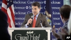 Republican presidential candidate Texas Governor Rick Perry addresses the Republican Leadership Conference at the Grand Hotel on Mackinac Island, Michigan, September 24, 2011.