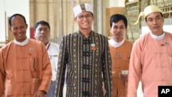 Lawmaker Henry Van Hti Yu walks into the parliament in Naypyitaw, Myanmar, Thursday, March 10, 2016.(AP Photo/Soe Gyi)