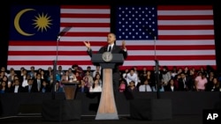 President Barack Obama gestures as he speaks during a town hall meeting at Malaya University in Kuala Lumpur, Malaysia, Sunday, April 27, 2014. 