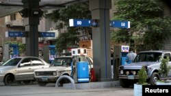 Cars are seen at a petrol station in downtown Cairo, Egypt, June 19, 2018. 