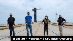 Jared Isaacman, Hayley Arceneaux, Sian Proctor and Chris Sembroski pose for a photo at NASA's Kennedy Space Center at Cape Canaveral, Florida, U.S., March 29, 2021 in this handout image provided by SpaceX. Picture taken March 29, 2021.