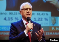 Czech presidential candidate Jiri Drahos delivers a speech at his headquarters, after polling stations closed for the country's direct presidential election, in Prague, the Czech Republic, Jan. 13, 2018.