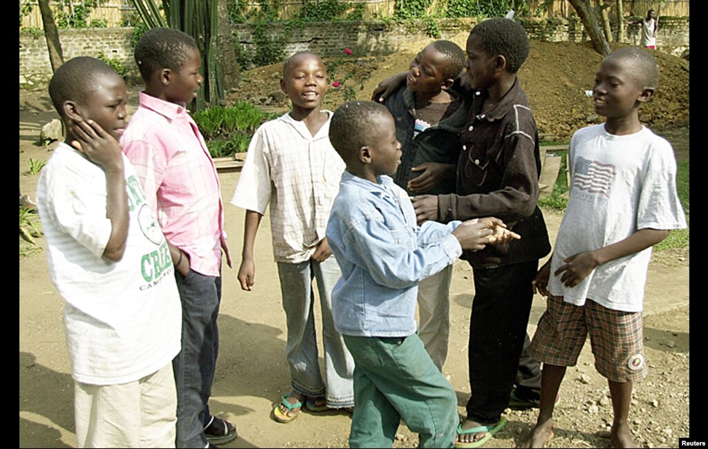 Seven child fighters are seen at a Save the Children compound in Bunia, Congo, June, 2003, after they left a militia army. Some 50 percent of tribal fighters in Ituri are children aged less than 18 years of age.