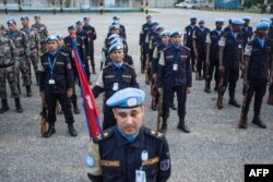 FILE - The Nepalese garrison stands at attention during the official closing ceremony of the United Nations Stabilization Mission in Haiti (MINUSTAH) in Tabarre Haiti on Oct. 5, 2017.