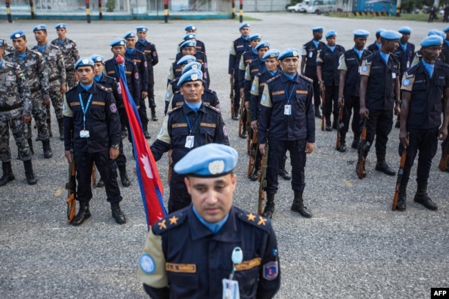 FILE - The Nepalese garrison stands at attention during the official closing ceremony of the United Nations Stabilization Mission in Haiti (MINUSTAH) in Tabarre Haiti on Oct. 5, 2017.
