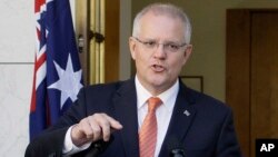 Australian Prime Minister Scott Morrison addresses media at Parliament House in Canberra, Australia, Feb. 13, 2019.