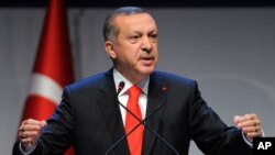 FILE - Turkey's Prime Minister Recep Tayyip Erdogan addresses a forum in Istanbul, Turkey, Oct. 13, 2012. 