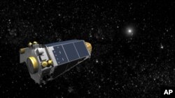 An artist's concept provided by NASA shows the Keplar Spacecraft moving through space.