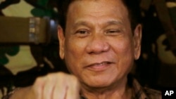 Philippine President Rodrigo Duterte, sen in this Aug. 25, 2016, gestures with a fist bump during his visit to the Philippine Army's Camp Mateo Capinpin at Tanay township, Rizal province east of Manila, Philippines. The Philippine president has apologized to Jews worldwide after his remarks that drew comparisons between his bloody anti-drug war and Hitler and the Holocaust sparked shock and outrage. 