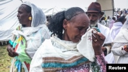 FILE - An Ethiopian woman cries after meeting relatives from Eritrea during the border reopening ceremony on Sept. 11, 2018, Zalambessa, northern Ethiopia. It was not clear why, but Ethiopians were being prevented from entering Eritrea at the Zalambessa crossing, Dec. 27, 2018.