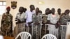 Des soldats sud-soudanais, lors du prononcé du verdict à leur procès pour viol et meurtre dans un hôtel de Juba en 2016, Juba, Soudan du Sud, le 6 septembre 2018.