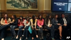 Invited students from Yuma and Pueblo, Colorado, listen to a Colorado Legislature debate on a bill which would grant in-state tuition to undocumented students, inside the State Capitol, in Denver, March 5, 2013.