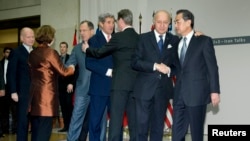 Officials from six world powers and Iran reached an agreement on that country's nuclear activities.