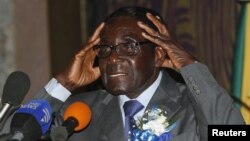 Zimbabwe's President Robert Mugabe speaks at the start of a conference of parties and civic society groups reviewing a draft constitution that, if adopted, will lead to Zimbabwe's next election, at a hotel in Harare, October 22, 2012.