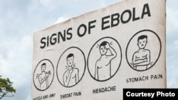 FILE - Sign displaying the symptoms of Ebola. (Credit: AGI)