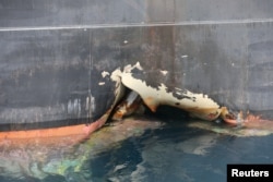 FILE - A damaged Andrea Victory ship is seen off the Port of Fujairah, United Arab Emirates, May 13, 2019.