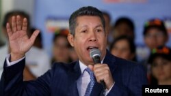 FILE - Venezuelan opposition presidential candidate Henri Falcon talks to the media during a news conference in Caracas, Venezuela, Jan. 24, 2018.