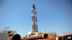 Drilling tubing is piled next to the drilling site number 102 in the Unity oil field, South Sudan (2010 file photo).