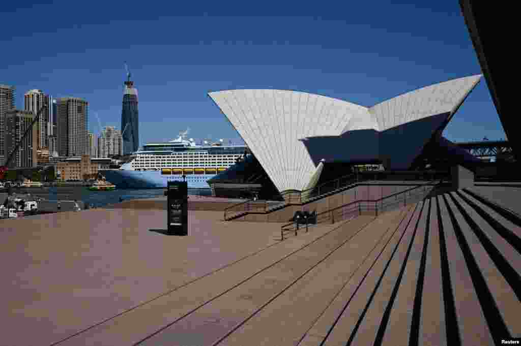 The mostly deserted steps of the Sydney Opera House, where scheduled public performances have been cancelled due to the coronavirus disease (COVID-19), are seen on a quiet morning in Sydney, Australia, March 18, 2020.