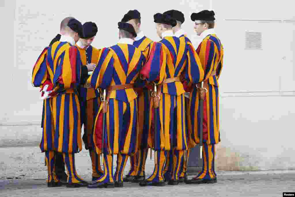 Swiss guards gather before a weekly general audience led by Pope Francis in Saint Peter's Basilica, at the Vatican.