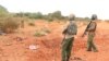 FILE - A Kenyan security person stands at the scene where a blast killed Kenyan police officers at the Garissa county, eastern Kenya, May 24, 2017.