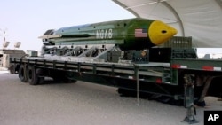 This undated photo provided by Eglin Air Force Base shows a GBU-43B, or massive ordnance air blast weapon, the U.S. military's largest non-nuclear bomb, which contains 11 tons of explosives. The Pentagon said U.S. forces in Afghanistan dropped a GBU-43B on an Islamic State target in Afghanistan, April 13, 2017, in what a Pentagon spokesman said was the first-ever combat use of the bomb. 
