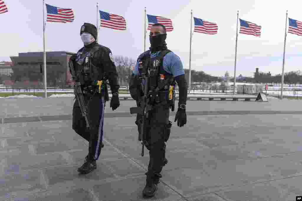 U.S. Park Police walk along the National Mall in Washington, D.C.&nbsp;Thursday marks the first anniversary of the Capitol insurrection, a violent attack that greatly changed Congress and led to widespread concerns about the future of American democracy.