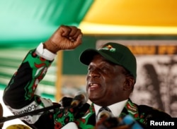 FILE - Zimbabwe's President Emmerson Mnangagwa speaks during the Extraordinary Congress of the ruling ZANU-PF party in Harare, Zimbabwe, Dec. 15, 2017.