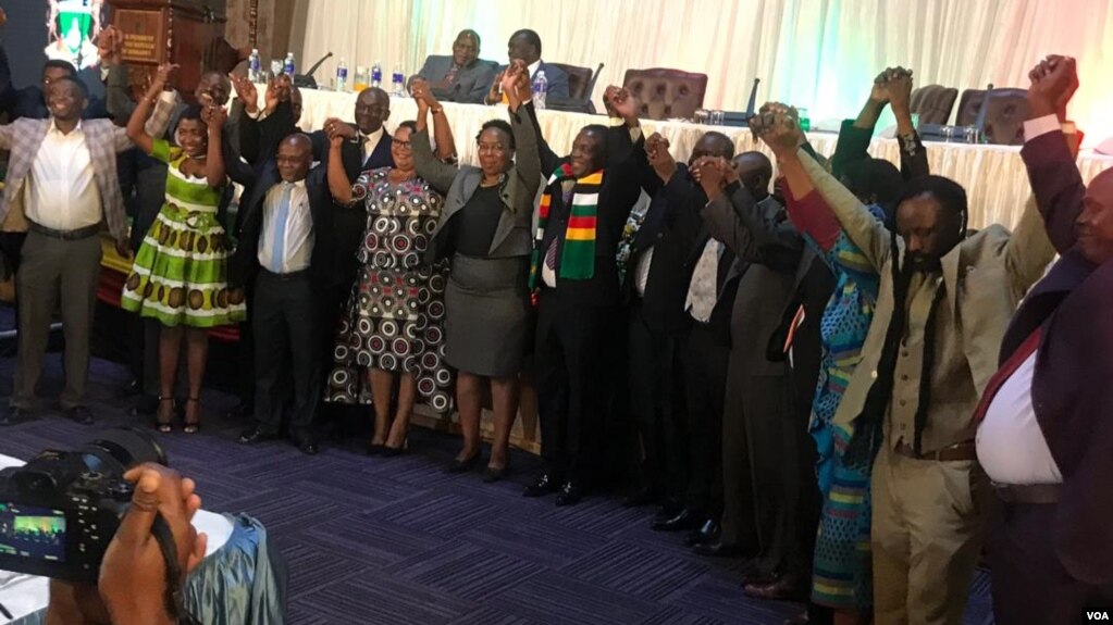 President Mnangagwa and other political leaders in Zimbabwe holding hands in Harare on Friday.