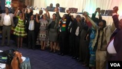 President Mnangagwa and other political leaders in Zimbabwe holding hands in Harare on Friday.