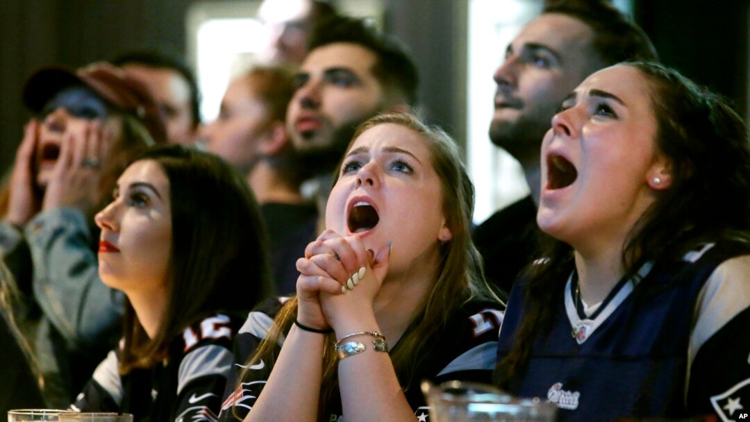 Kathleen Doherty, center, of Woburn, Mass., reacts with other fans at a Boston bar while watching the New England Patriots' final drive during the first half of the NFL Super Bowl 52 football game between the Patriots and the Philadelphia Eagles in Minneapolis, Sunday, Feb. 4, 2018.