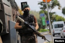 A police special forces member stands guard on a street in Istanbul, Turkey, July 18, 2016.