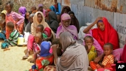 Displaced Somalis who fled the drought in southern Somalia sit in a camp in the capital Mogadishu, Somalia, Feb. 18, 2017.