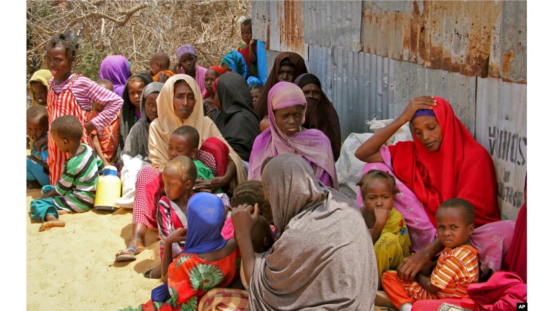 Displaced Somalis who fled the drought in southern Somalia sit in a camp in the capital Mogadishu, Somalia, Feb. 18, 2017.
