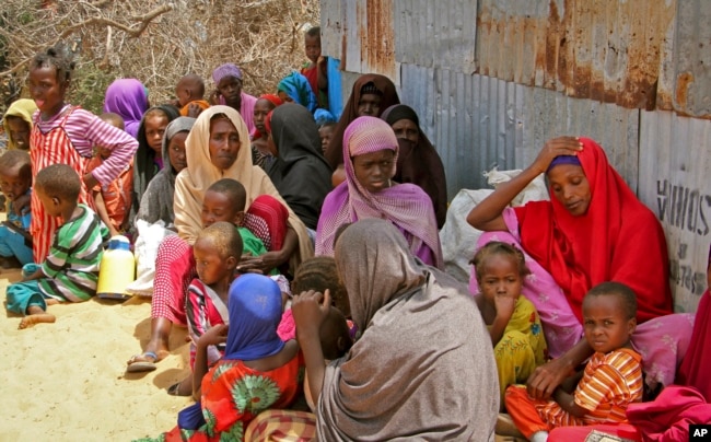 Displaced Somalis who fled the drought in southern Somalia sit in a camp in the capital Mogadishu, Somalia, Feb. 18, 2017.