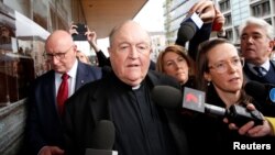 FILE - Archbishop Philip Wilson leaves Newcastle Local Court, in Newcastle for sentencing, Australia, July 3, 2018. 
