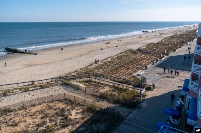 FILE - The beach and boardwalk are seen, Friday, Nov. 13, 2020, in Rehoboth Beach, Delaware. (AP Photo/Alex Brandon)