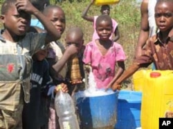 Children in Mwanza at one of the water taps
